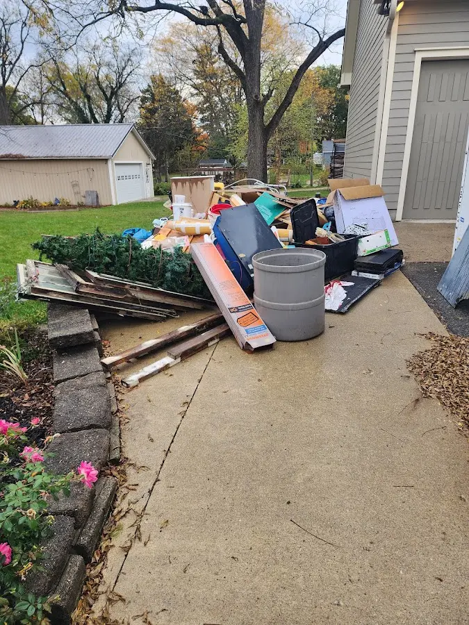 Dumpster being loaded with debris for Commercial Dumpster Rental in Meadow Vista